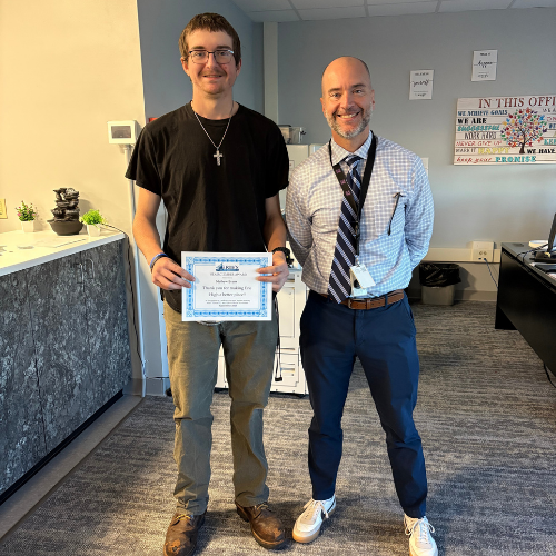 Mathew Evans, Erie High's Stairclimber for October, poses with his award plaque.